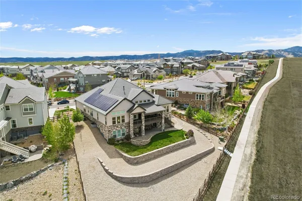 an aerial view of a house with a ocean view
