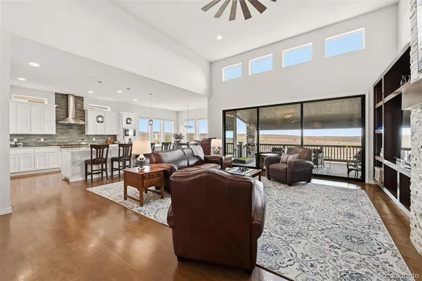 a living room with lots of furniture and a flat screen tv