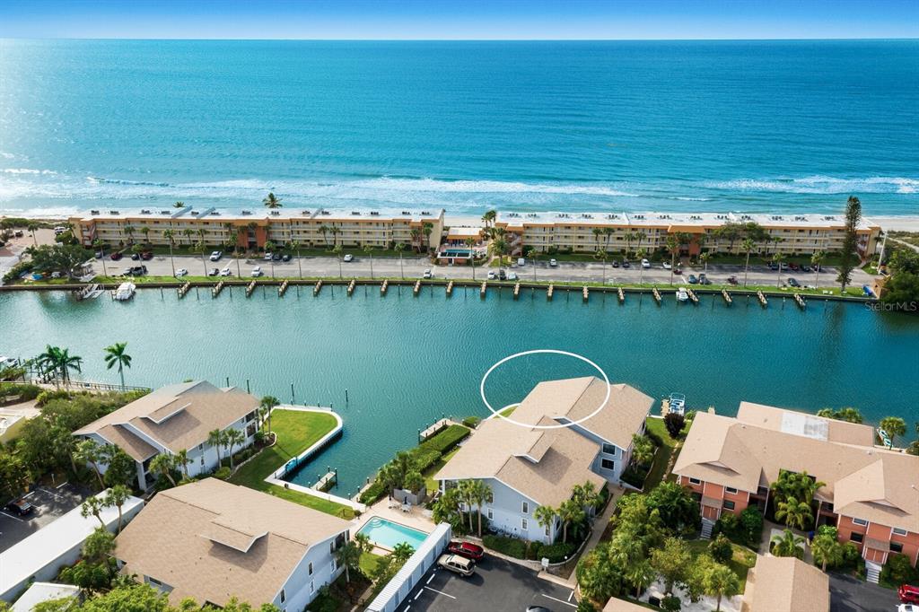 9054 Midnight Pass Road, Unit 3 Sarasota, FL 34242 - Photo 1 of 1 an aerial view of a house with a lake view