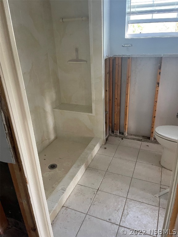 1234 Wayne Avenue New Smyrna Beach, FL 32168 - Photo 9 of 15 a bathroom with a glass door shower and toilet