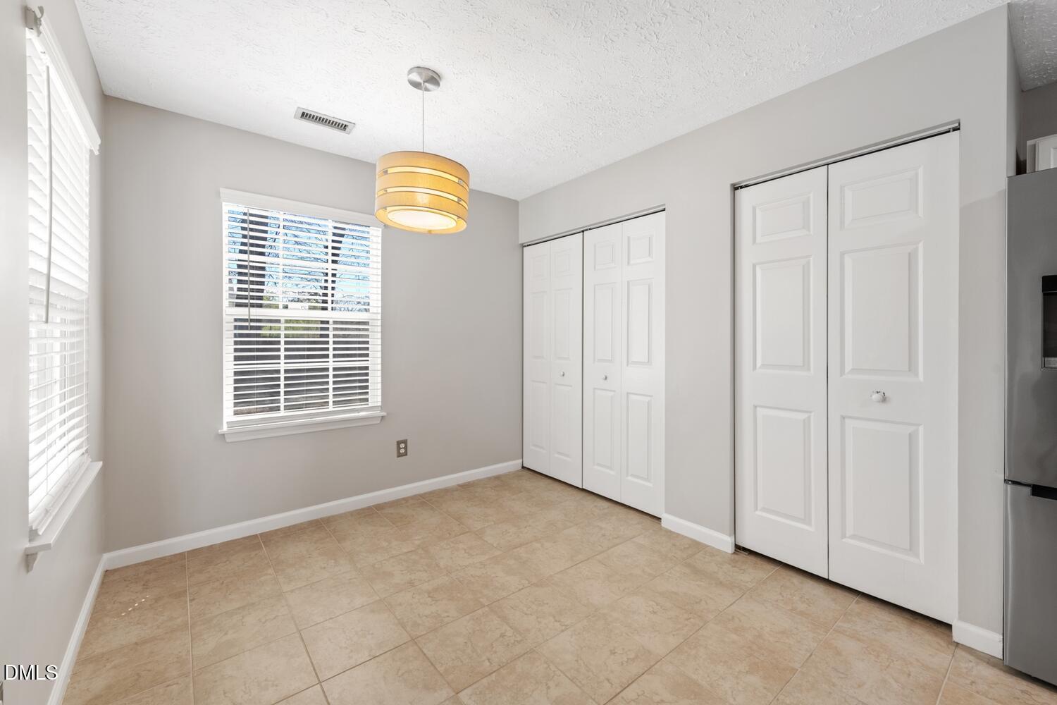 6900 Glenroy Court Raleigh, NC 27616 - Photo 12 of 30 a view of an empty room with a window