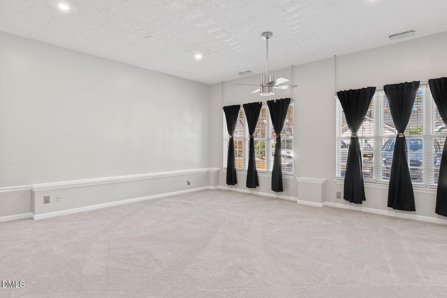 6900 Glenroy Court Raleigh, NC 27616 - Photo 14 of 30 an empty room with closet and mirrors