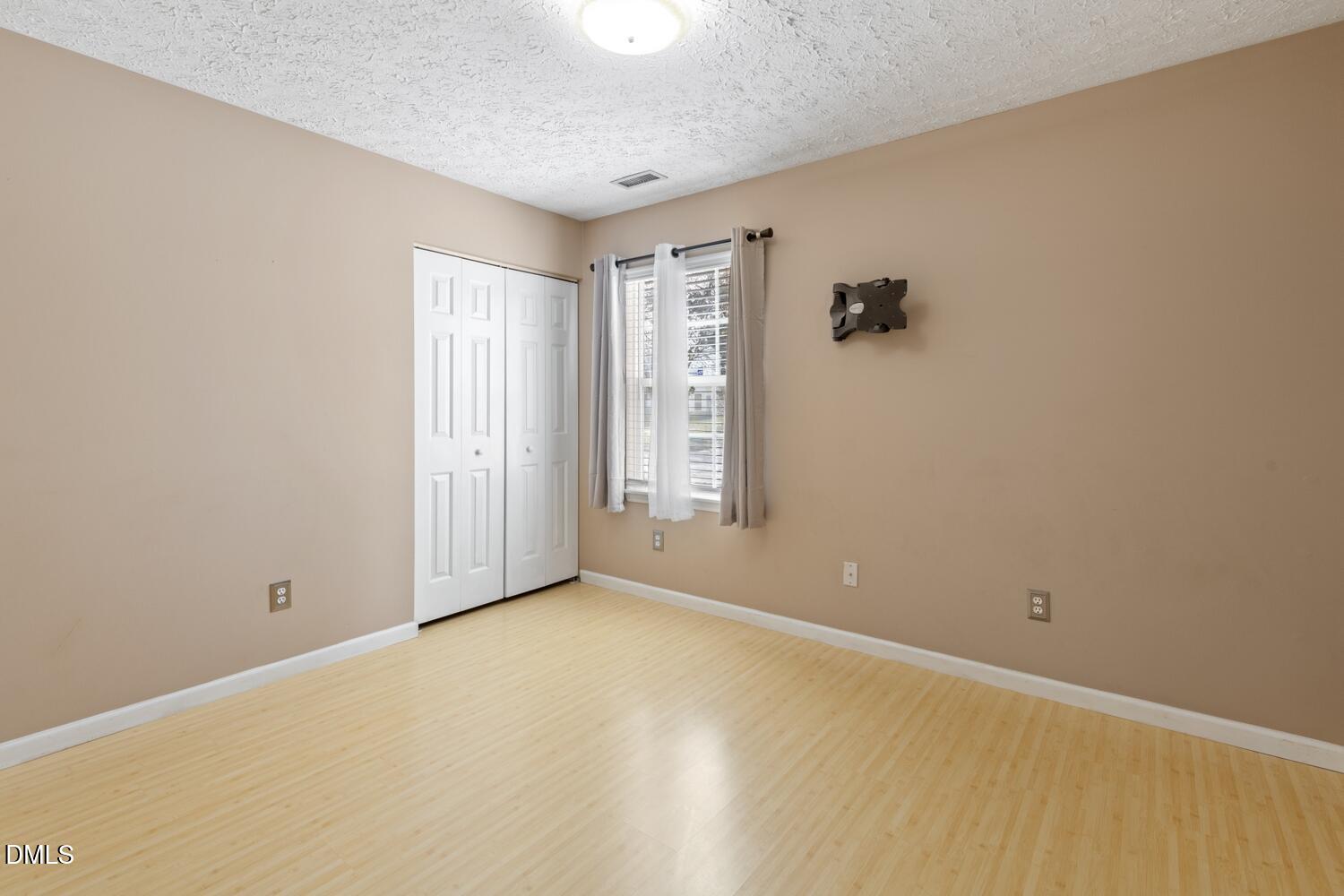 6900 Glenroy Court Raleigh, NC 27616 - Photo 20 of 30 a view of an empty room with a window