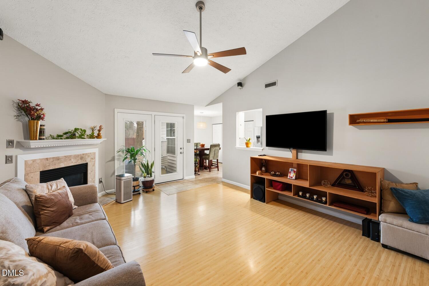 6900 Glenroy Court Raleigh, NC 27616 - Photo 2 of 30 a living room with furniture and a flat screen tv