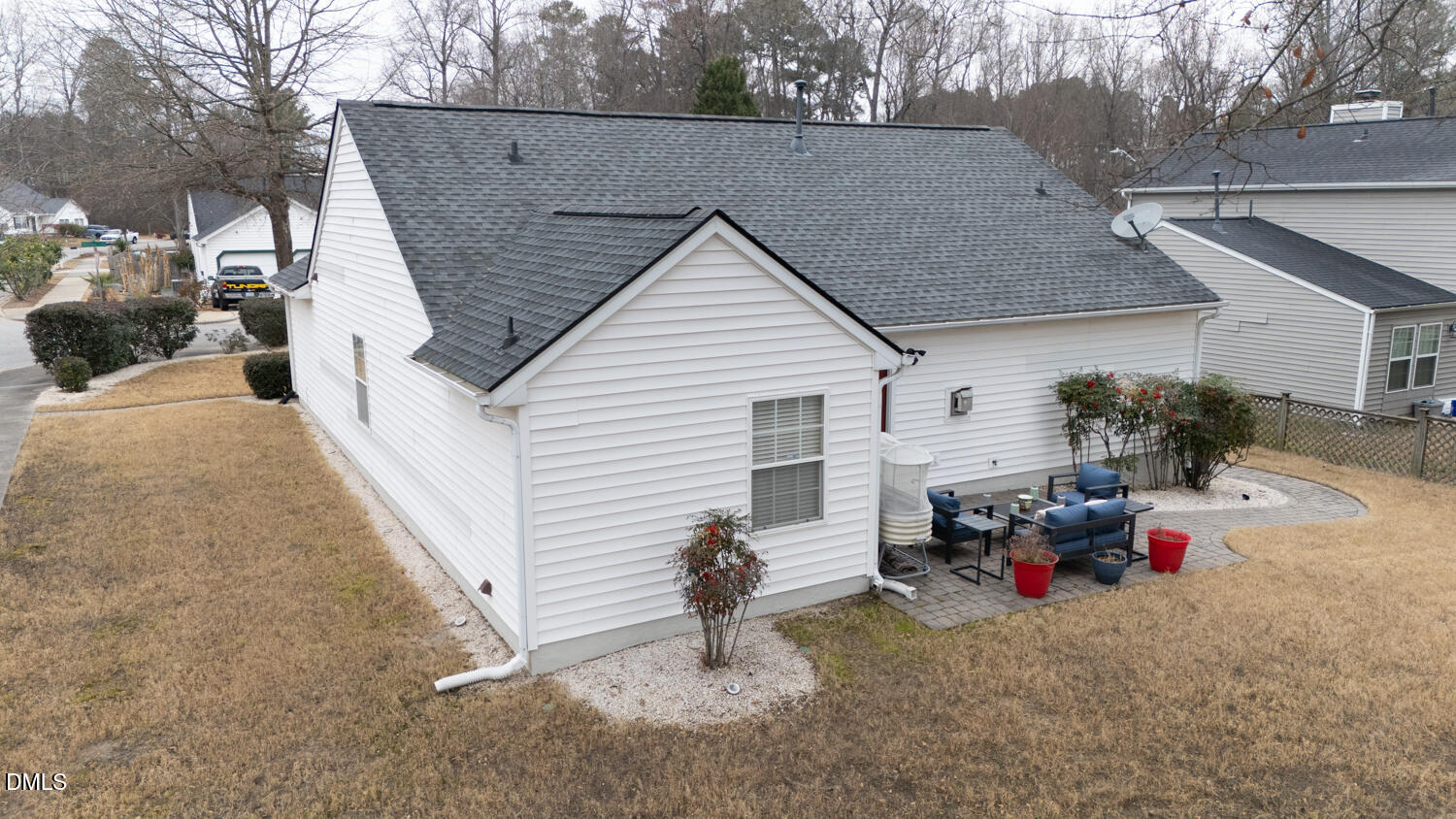 6900 Glenroy Court Raleigh, NC 27616 - Photo 24 of 30 a backyard of a house with fire pit and chairs