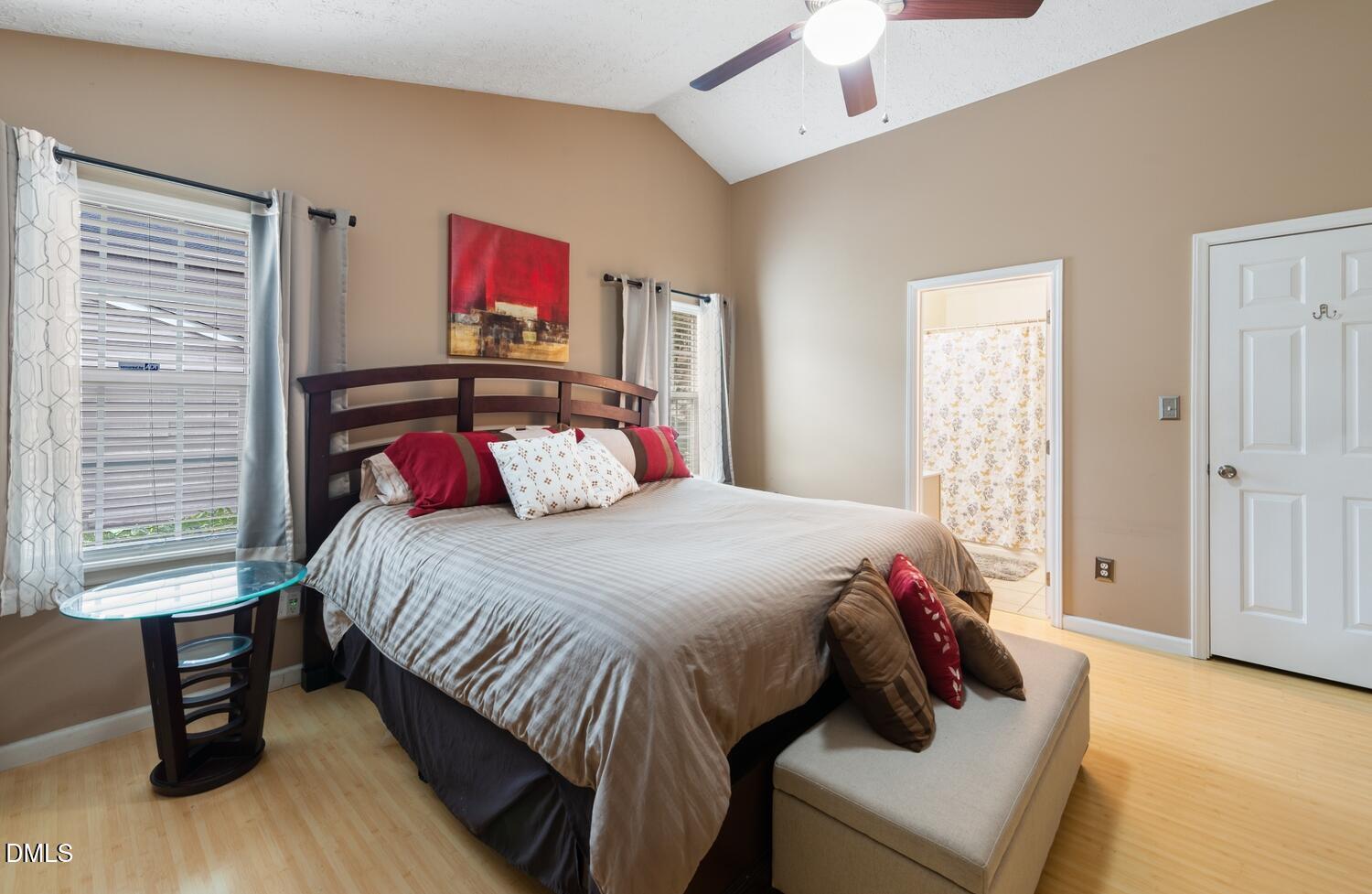 6900 Glenroy Court Raleigh, NC 27616 - Photo 5 of 30 a bed sitting in a bedroom next to a window