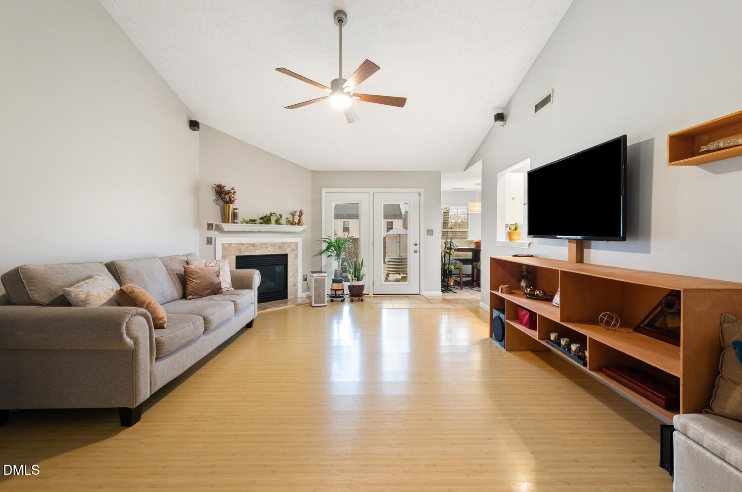 6900 Glenroy Court Raleigh, NC 27616 - Photo 8 of 30 a living room with furniture and a flat screen tv