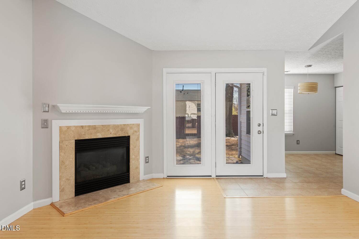 6900 Glenroy Court Raleigh, NC 27616 - Photo 9 of 30 a view of an empty room with window and fireplace