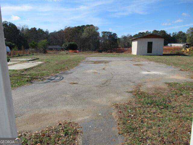 4294 Austell Powder Springs Road Southwest Powder Springs, GA 30127 - Photo 34 of 35 back yard parking + storage