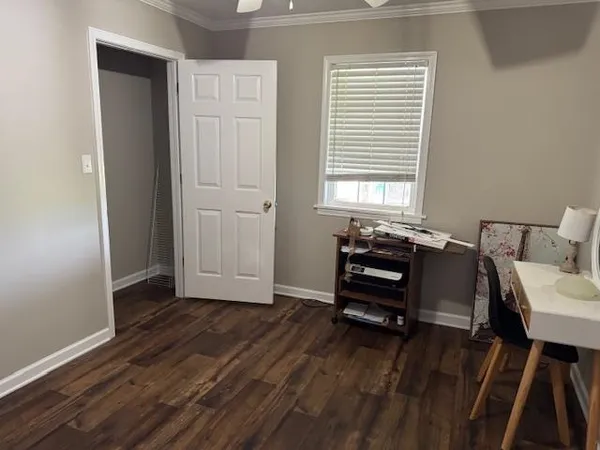 a view of a livingroom with furniture and wooden floor