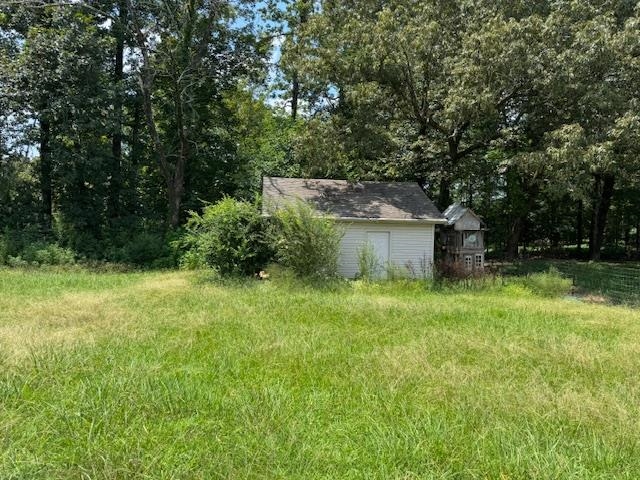 110 Falcon Cove Middleton, TN 38052 - Photo 19 of 20 a backyard of a house with trees and entertaining space