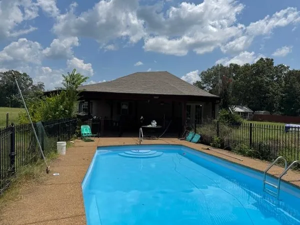 a front view of a house with swing