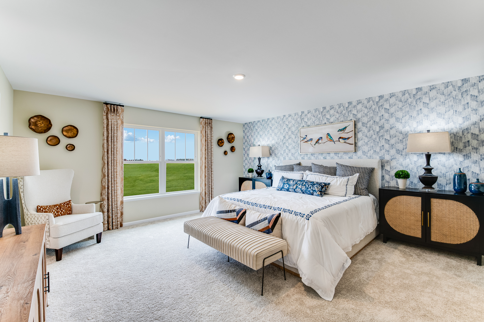 932 Juniper Drive Sycamore, IL 60178 - Photo 12 of 24 a spacious bedroom with a bed couch and a large window