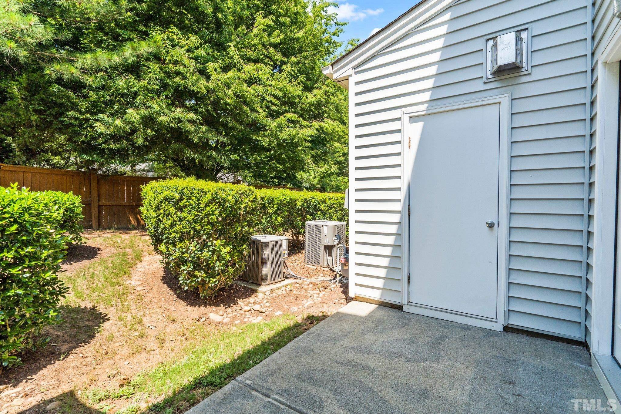 3012 Berkeley Springs Place Raleigh, NC 27616 - Photo 17 of 22 a view of a backyard with plants