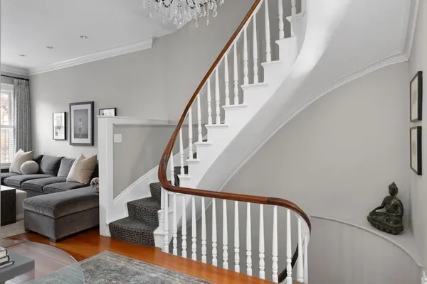 a living room with furniture and a rug