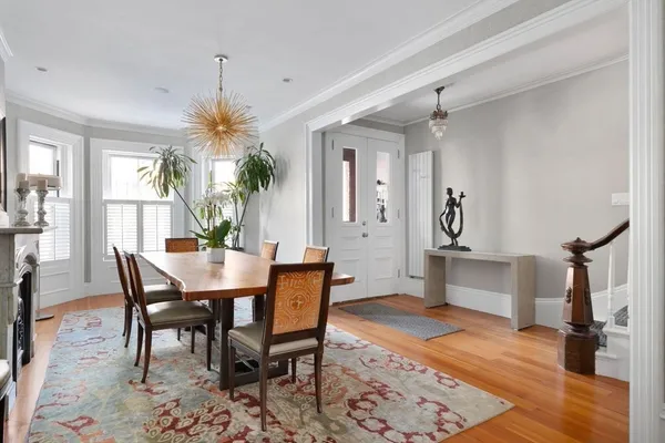 a dining room with furniture and window