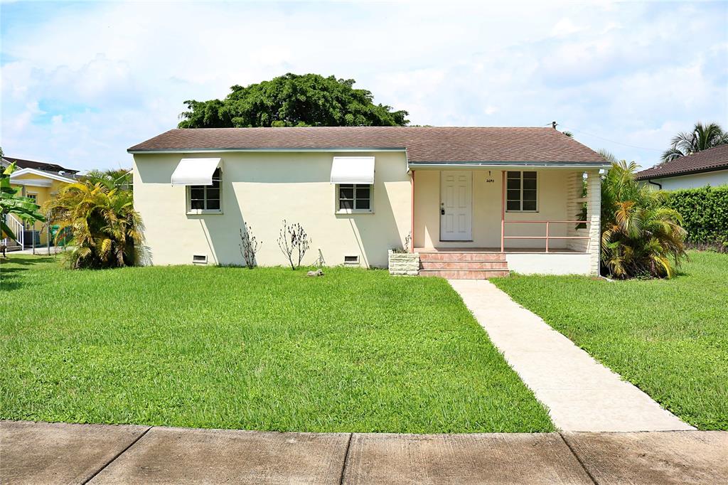 2640 Southwest 79th Avenue Miami, FL 33155 - Photo 2 of 23 a front view of a house with garden