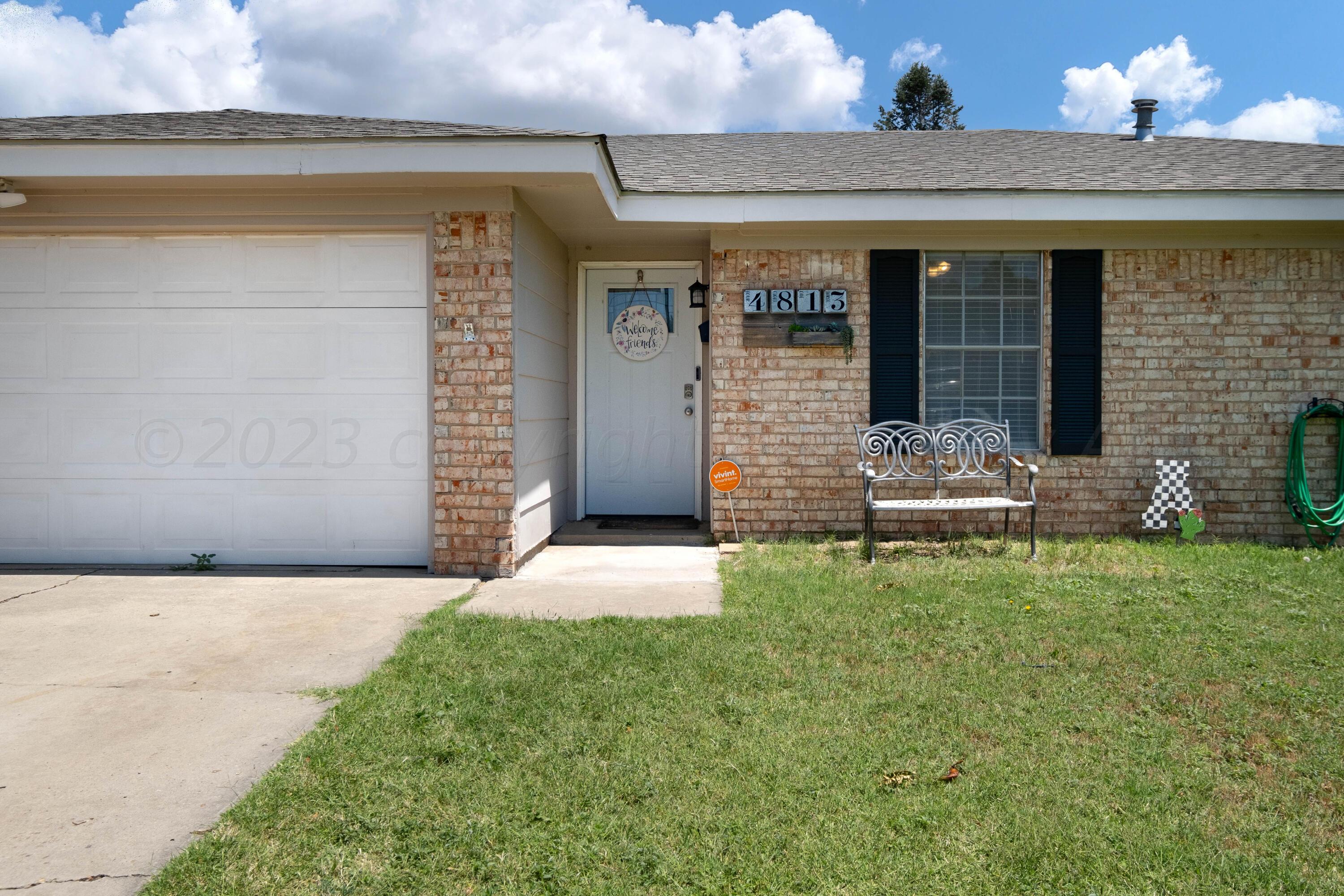 4813 South Rusk Street Amarillo, TX 79110 - Photo 7 of 23 a front view of a house with garden