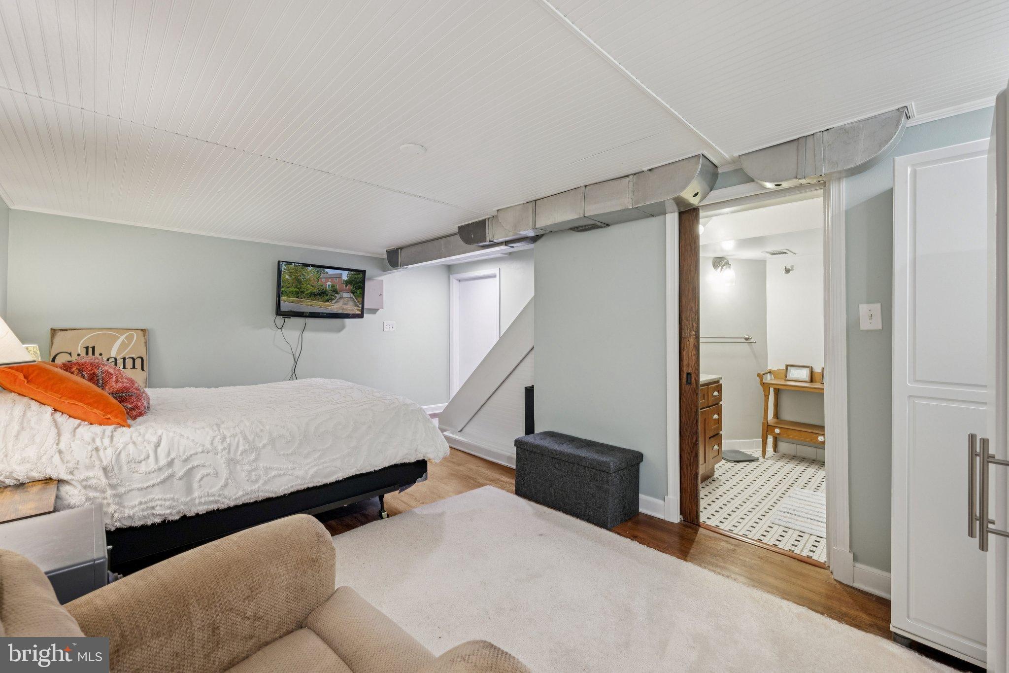 2307 Cheverly Avenue Cheverly, MD 20785 - Photo 13 of 25 a bedroom with furniture and a shower