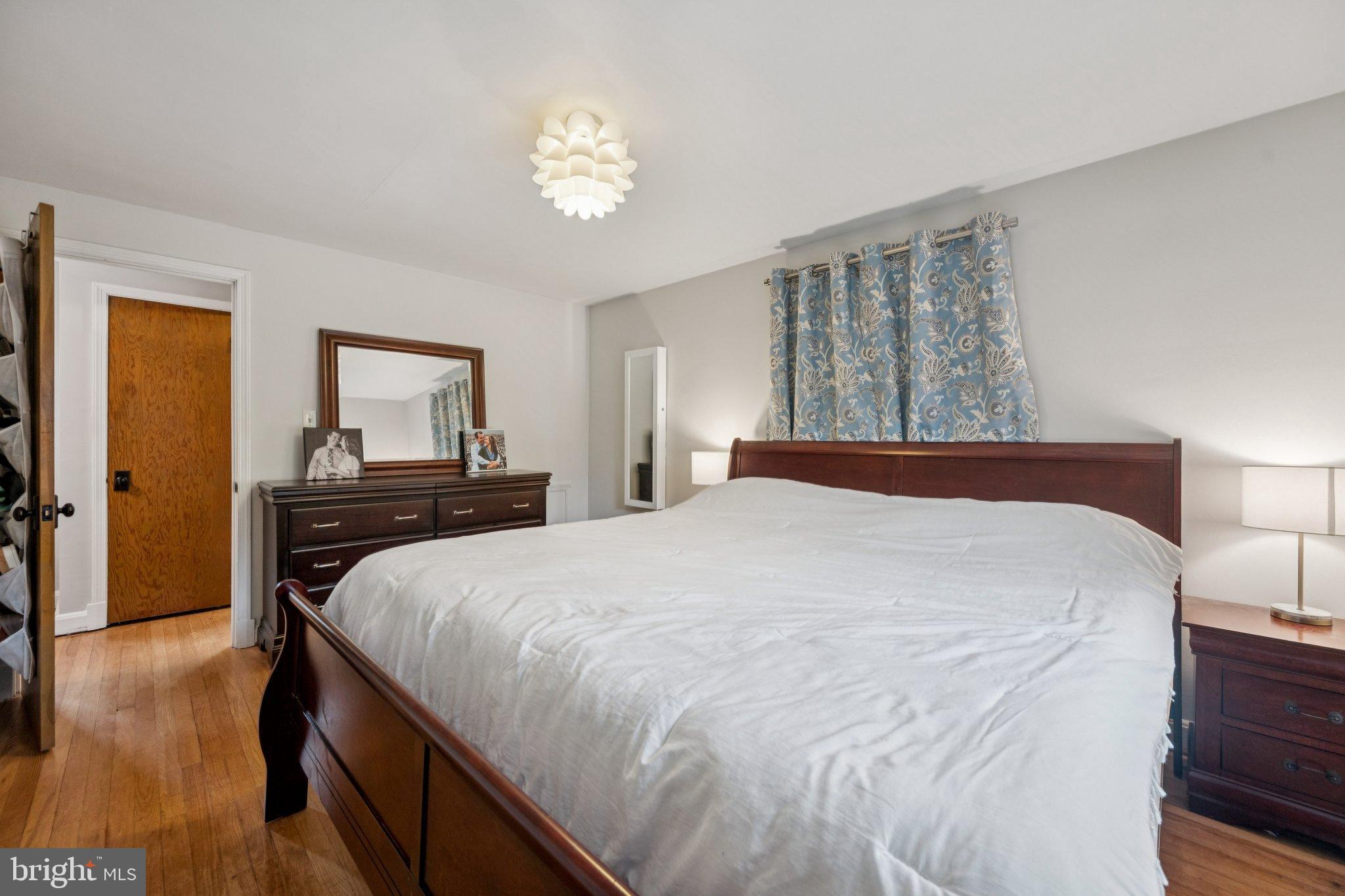 2307 Cheverly Avenue Cheverly, MD 20785 - Photo 21 of 25 a bedroom with a bed and a dresser