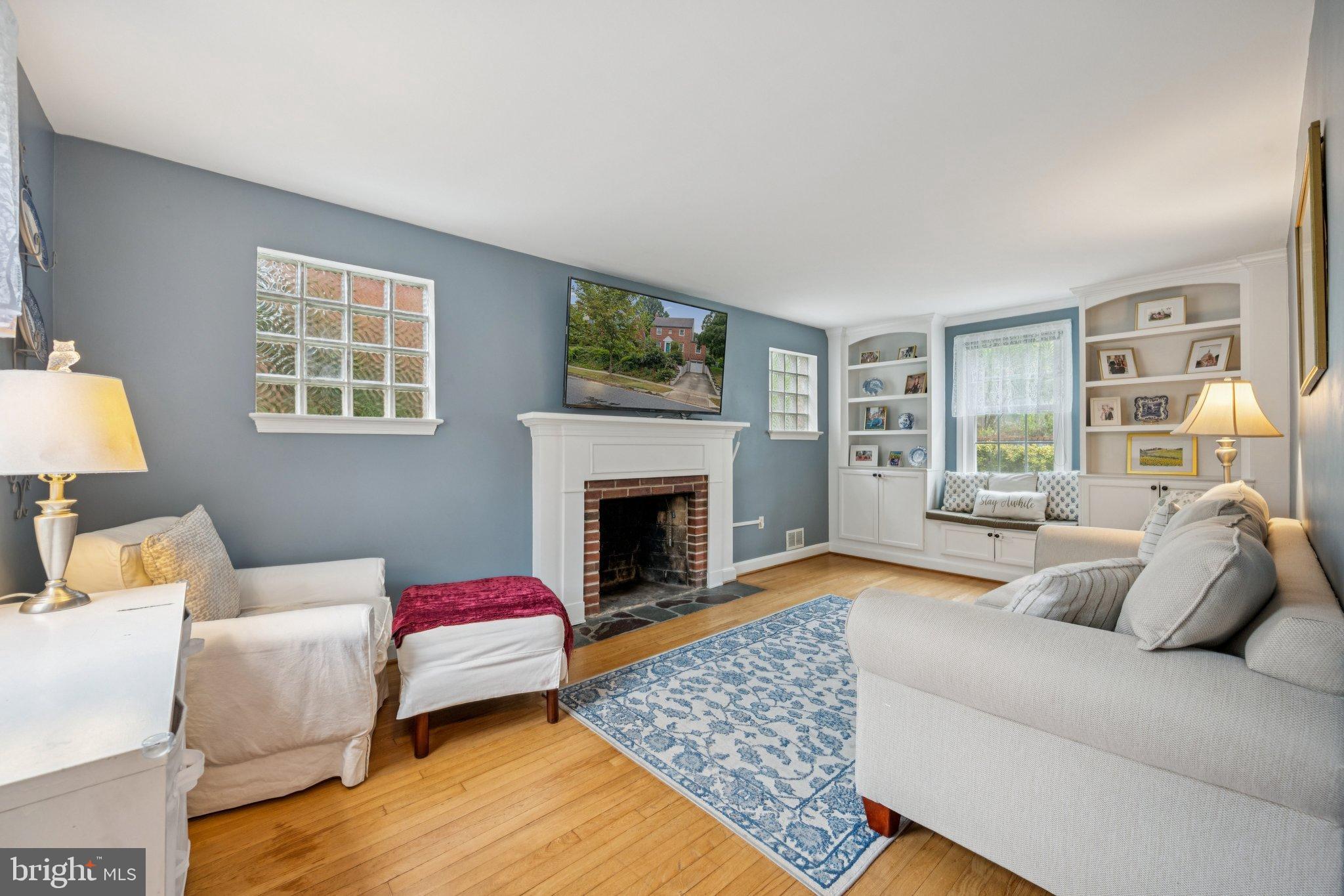2307 Cheverly Avenue Cheverly, MD 20785 - Photo 4 of 25 a living room with furniture and a fireplace