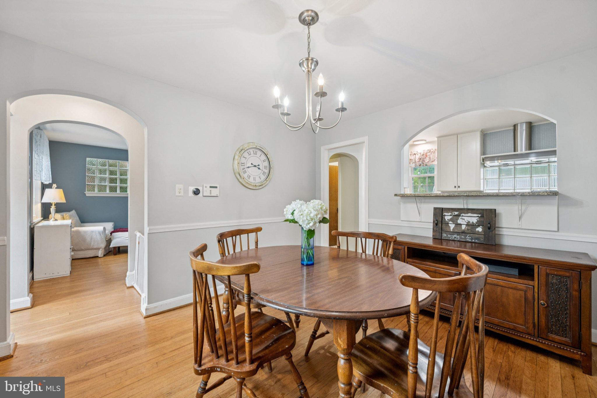 2307 Cheverly Avenue Cheverly, MD 20785 - Photo 5 of 25 a view of a dining room with furniture and a chandelier