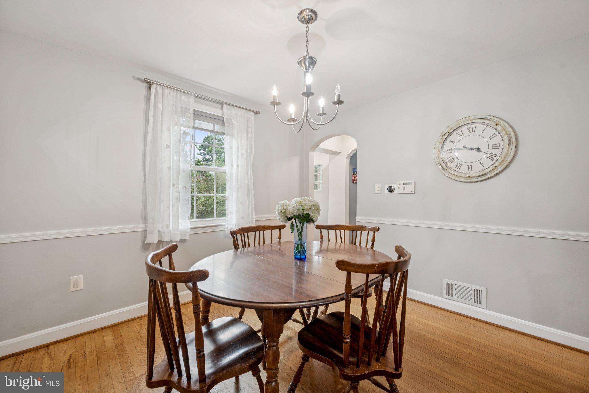2307 Cheverly Avenue Cheverly, MD 20785 - Photo 6 of 25 a view of a dining room with furniture window and wooden floor