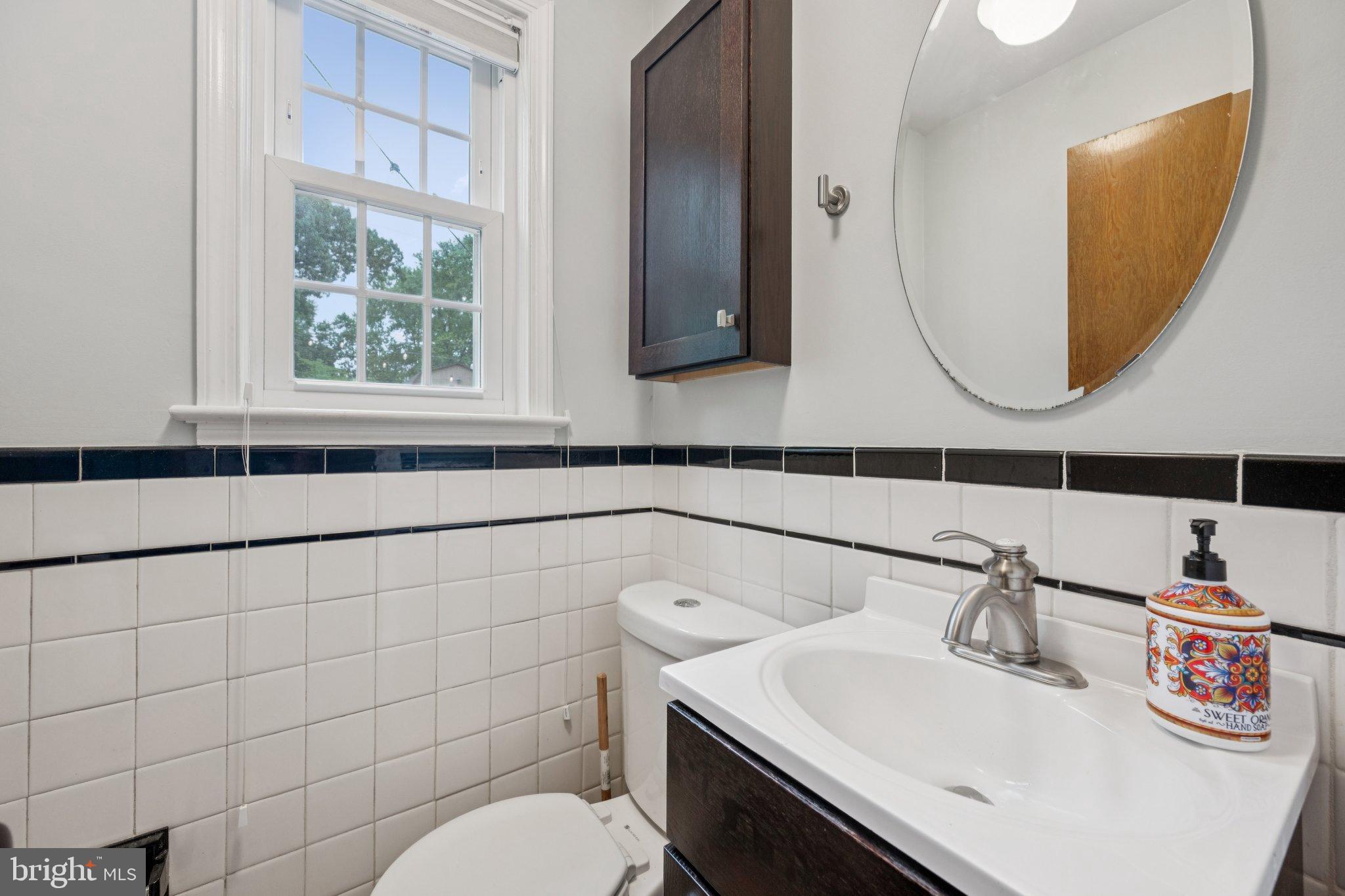 2307 Cheverly Avenue Cheverly, MD 20785 - Photo 9 of 25 a bathroom with a sink and a mirror