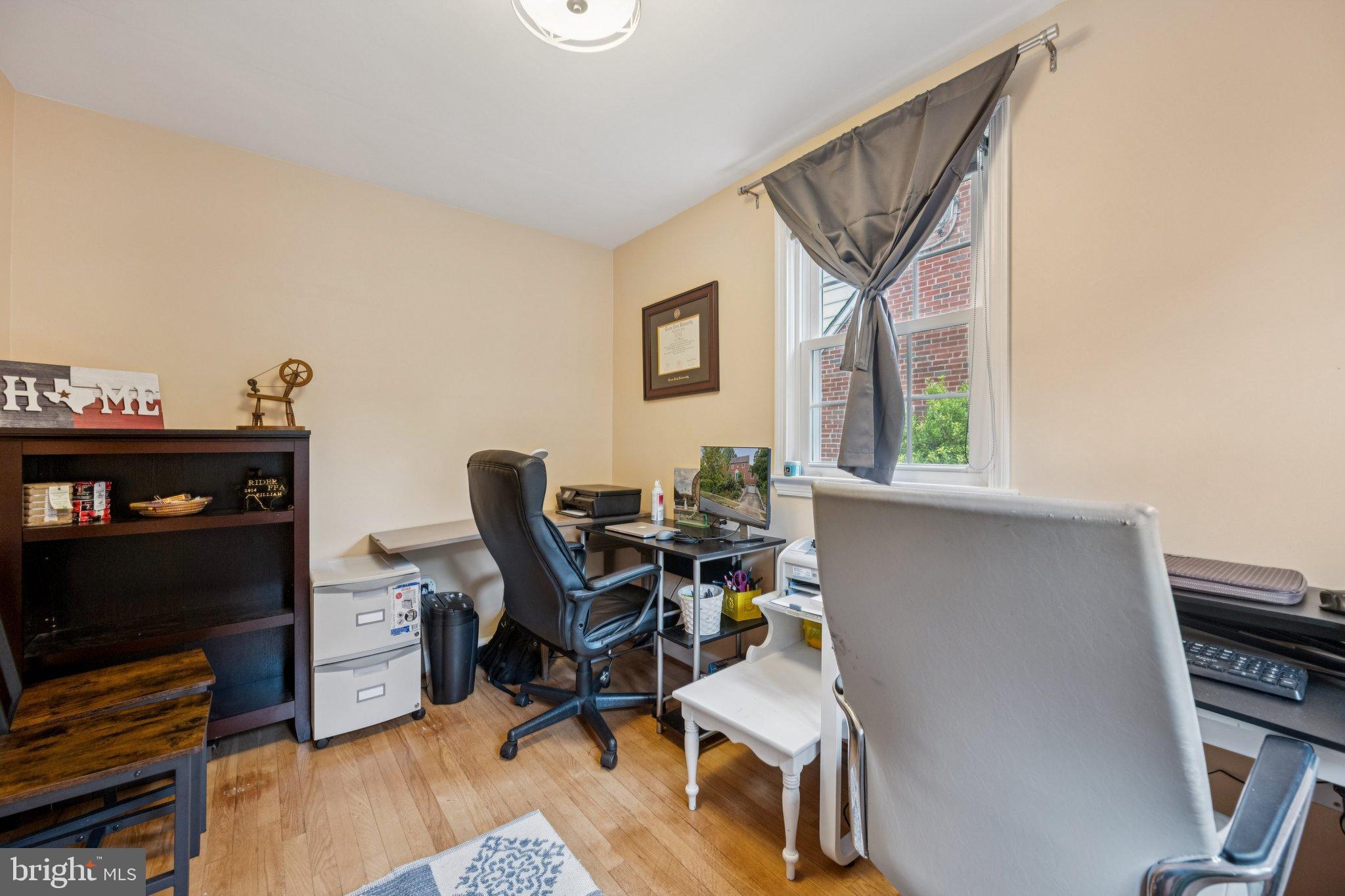 2307 Cheverly Avenue Cheverly, MD 20785 - Photo 10 of 25 a workspace with wooden floor and a window