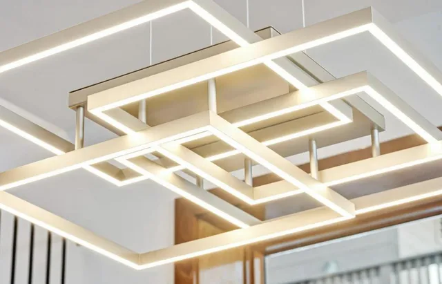 a view of staircase with railing and white walls