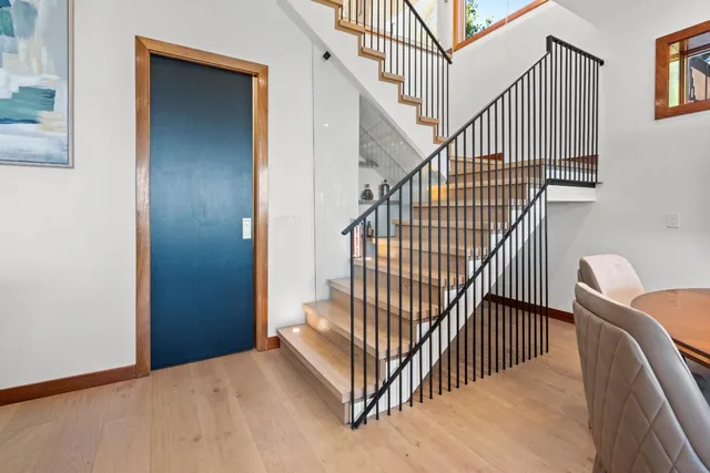 a bedroom with a large bed and a large window