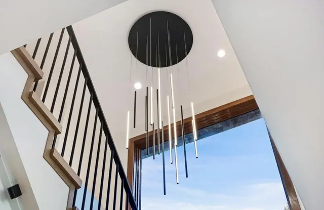 a bedroom with a large bed and a large window