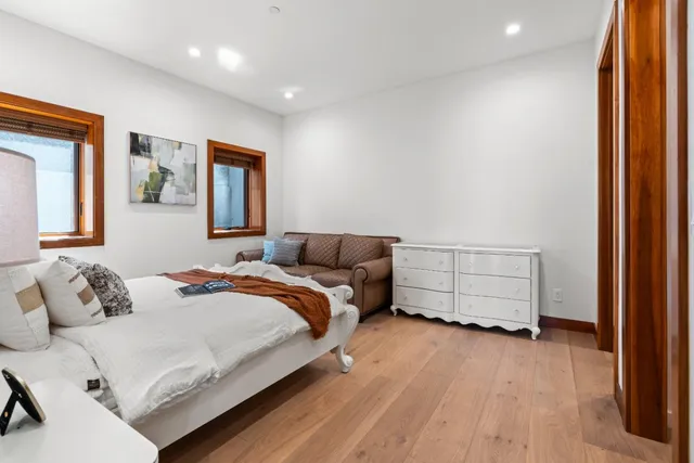 a bedroom with a bed and a couch