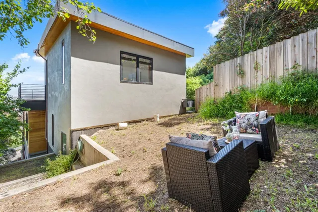 a view of a balcony with wooden floor and city view