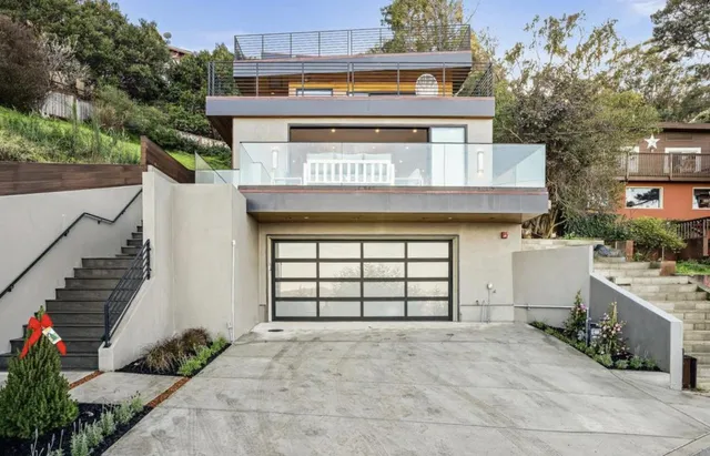an outdoor space with seating area and trees