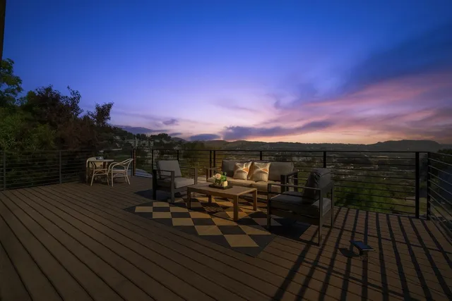 a view of a field with trees in the background