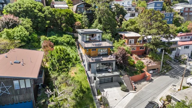 a large kitchen with stainless steel appliances kitchen island a large counter top a sink a stove and a center island