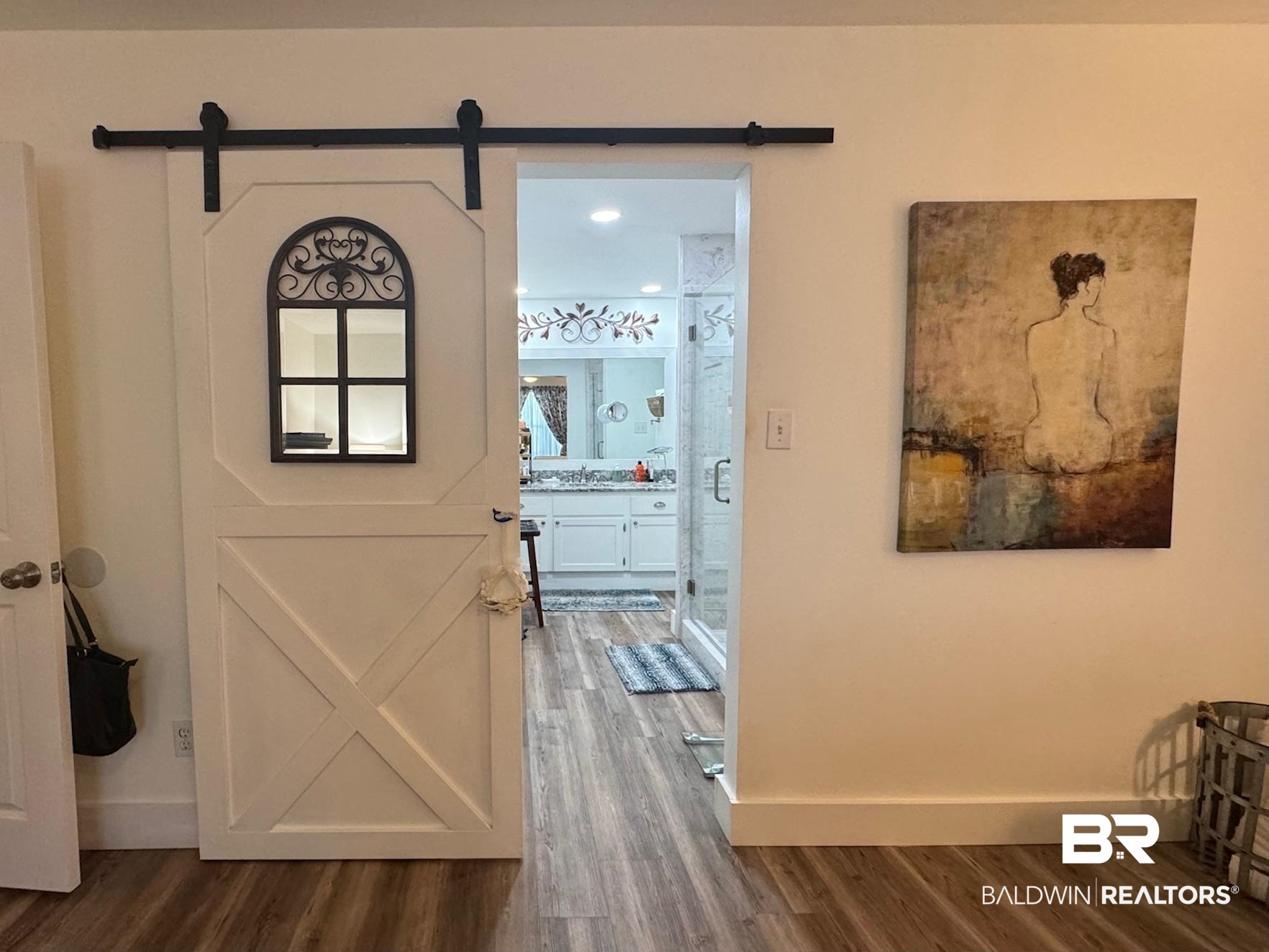 3200 Loop Road, Unit 55 Orange Beach, AL 36561 - Photo 16 of 40 Doorway with wood-type flooring and a barn door