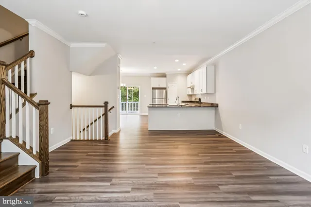 a view of kitchen and wooden floor