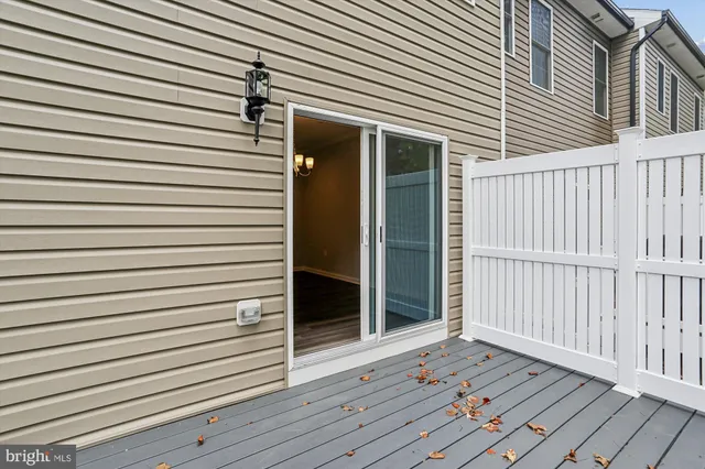 a view of a house with wooden deck