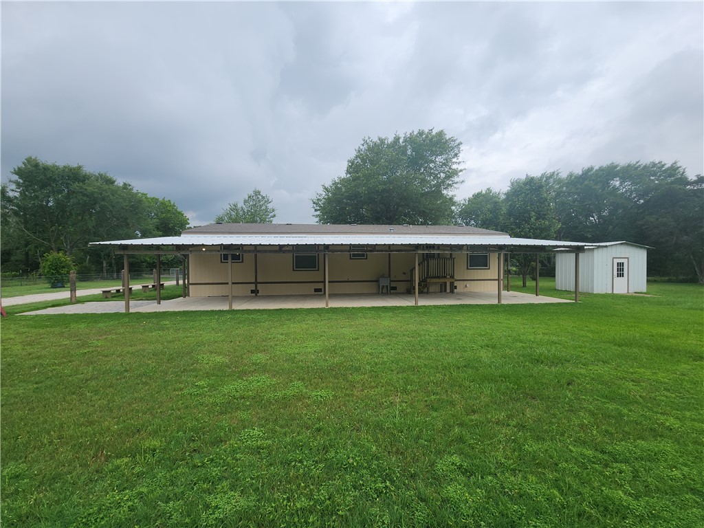 3738 Smetana Road Bryan, TX 77807 - Photo 25 of 29 a view of a house with backyard sitting area and garden