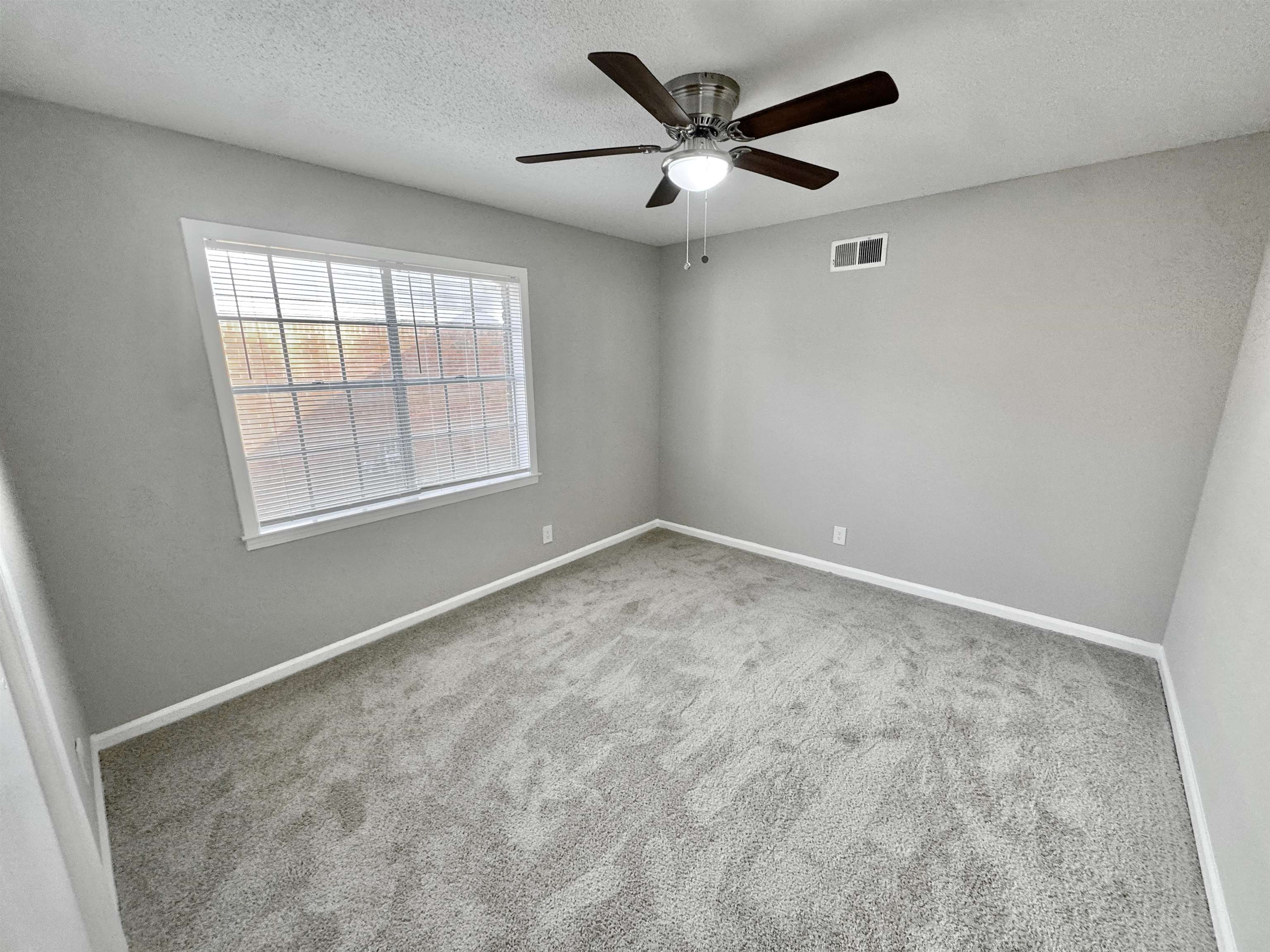 3429 Clarke Road Memphis, TN 38115 - Photo 14 of 33 an empty room with a window