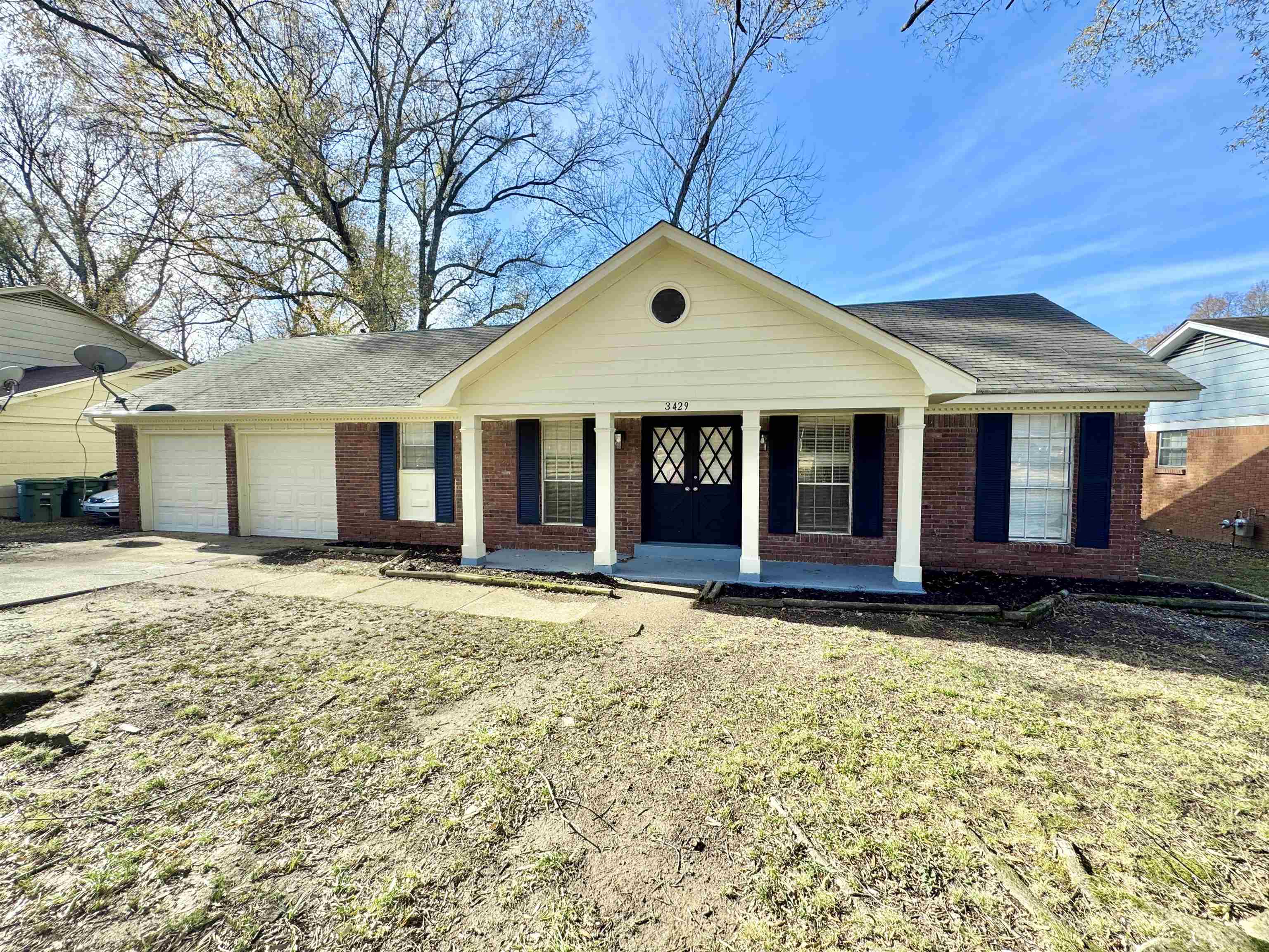 3429 Clarke Road Memphis, TN 38115 - Photo 2 of 33 a front view of a house with a garden