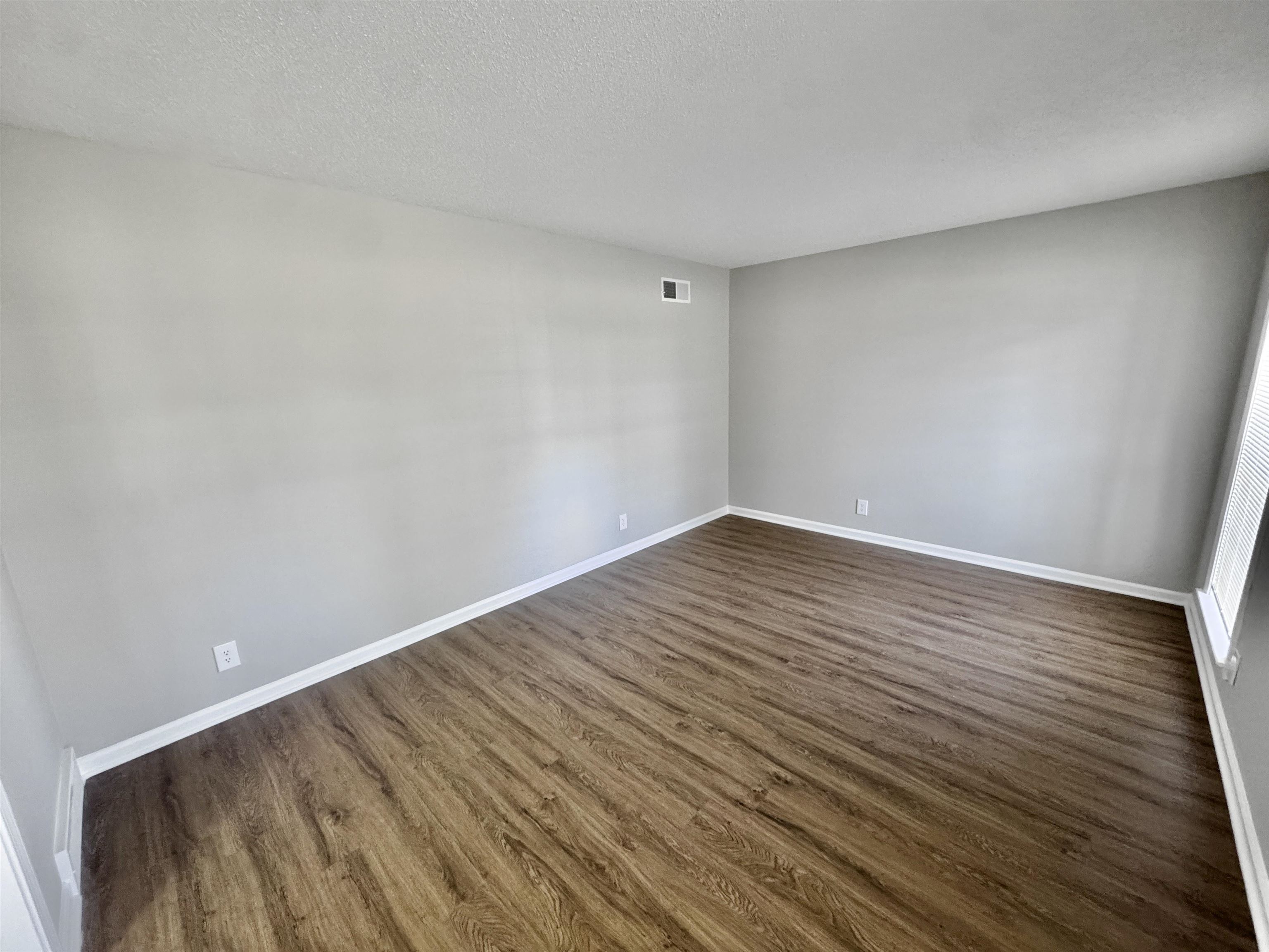 3429 Clarke Road Memphis, TN 38115 - Photo 23 of 33 a view of an empty room with wooden floor