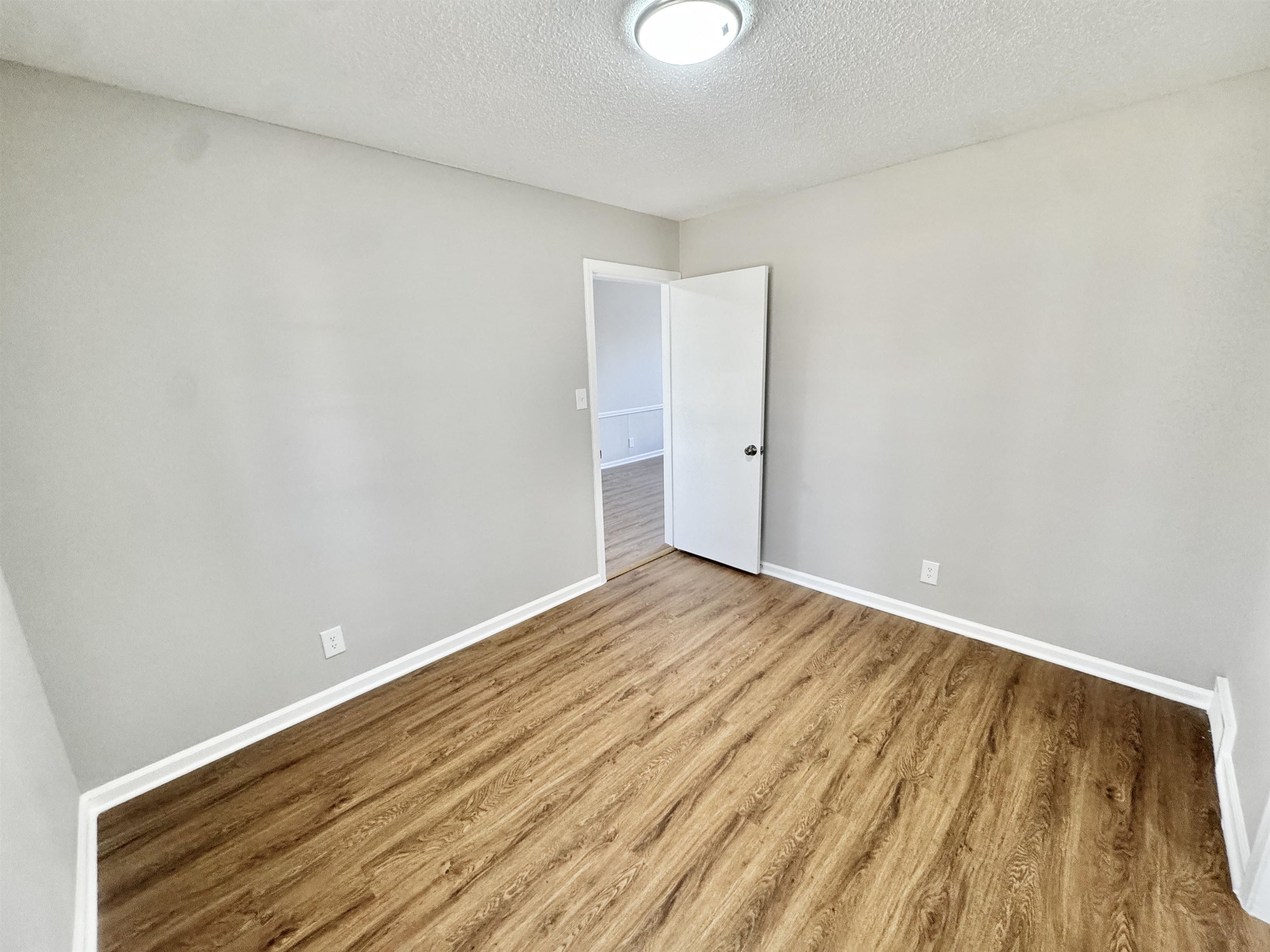 3429 Clarke Road Memphis, TN 38115 - Photo 24 of 33 a view of empty room with wooden floor