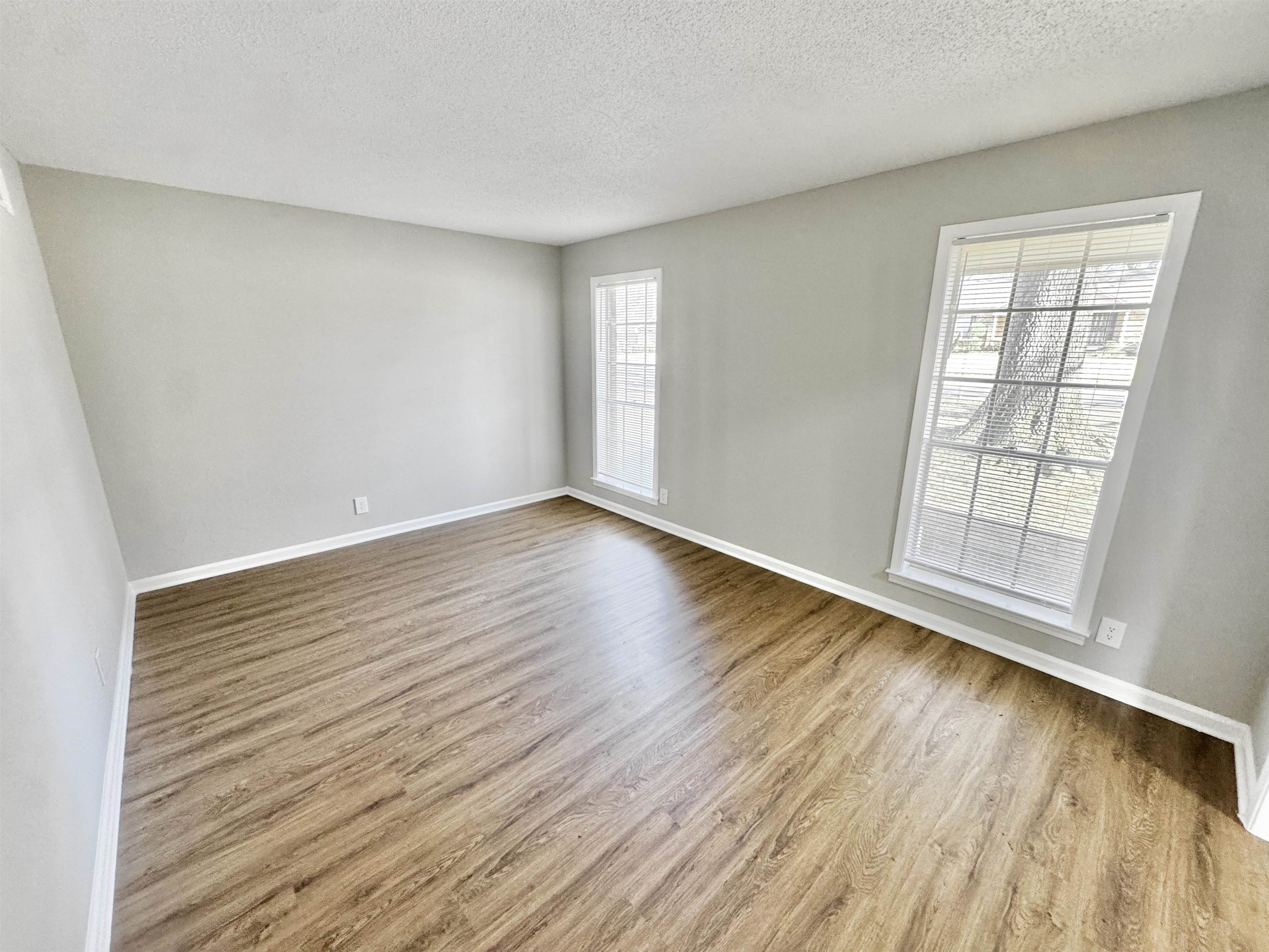 3429 Clarke Road Memphis, TN 38115 - Photo 5 of 33 wooden floor in an empty room with a window
