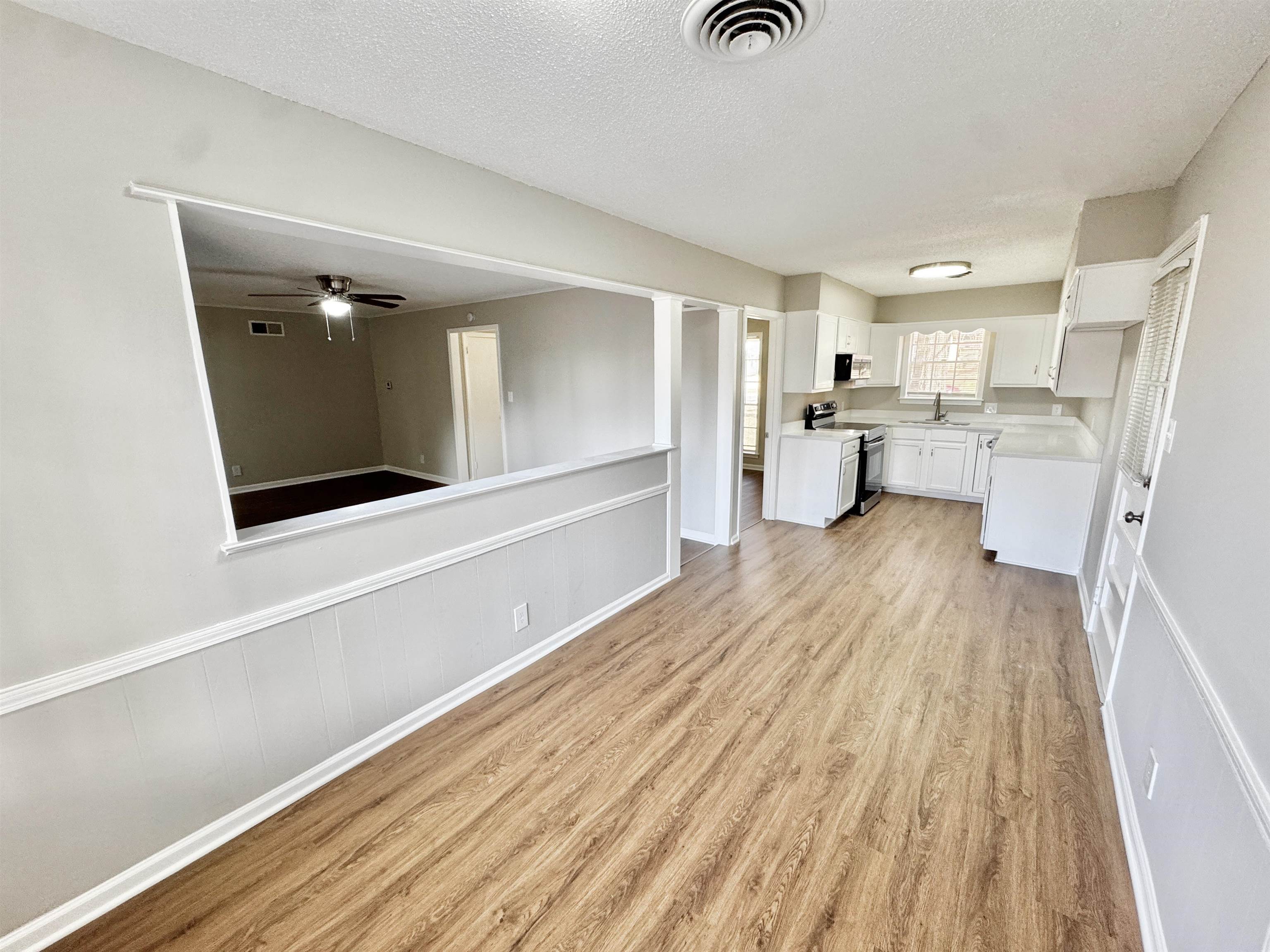 3429 Clarke Road Memphis, TN 38115 - Photo 9 of 33 a view of a living room with furniture and wooden floor