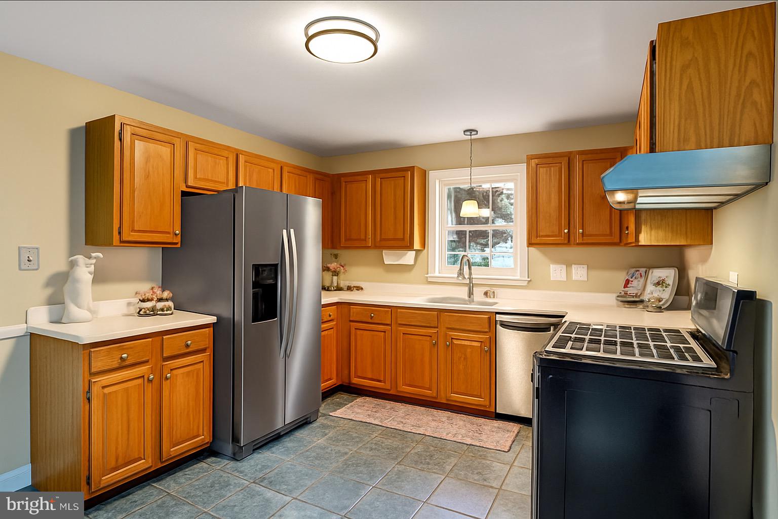 107 West Cameron Road Falls Church, VA 22046 - Photo 9 of 37 Kitchen has gas stove and beautiful wood cabinets