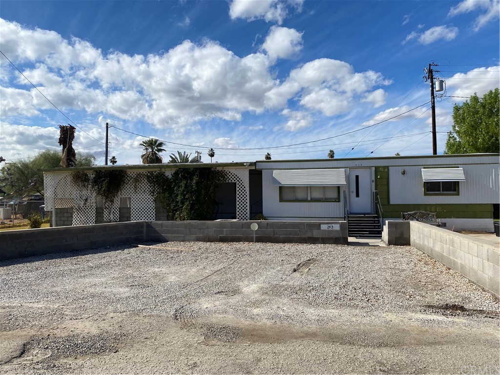 213 Elm Road Blythe, CA 92225 - Photo 2 of 61 a front view of a house with a yard