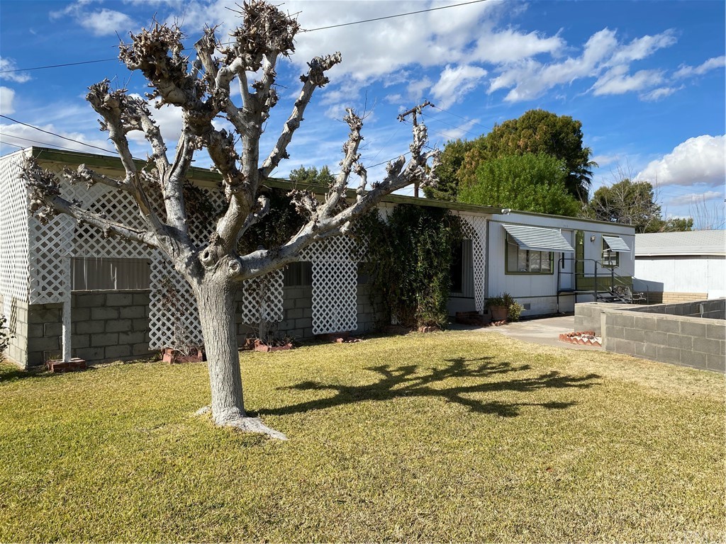 213 Elm Road Blythe, CA 92225 - Photo 3 of 61 a house with trees in the background